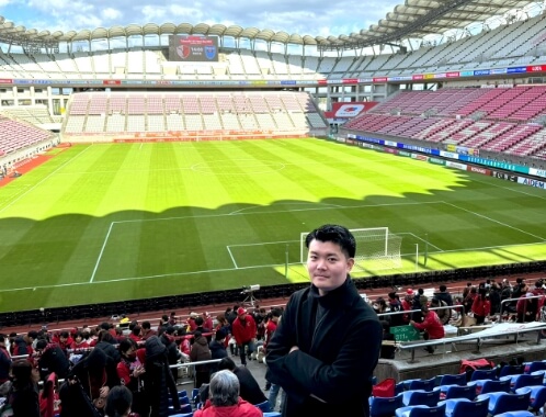 サッカースタジアムにいるY.Mさんの画像